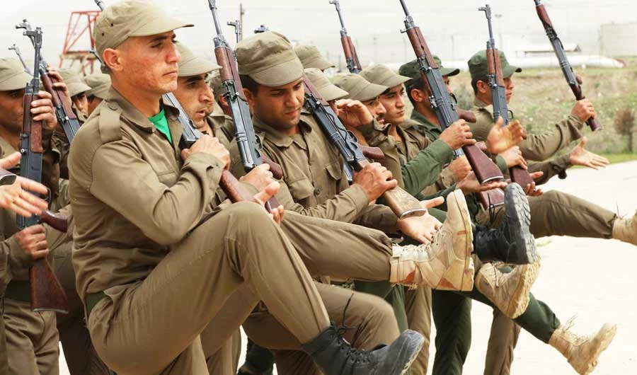 Syrian-Kurdish Peshmerga fighters and members of the Rojava Forces Defence Units take part in routine military exercises in the town of Faysh Khabur. (AFP file photo)