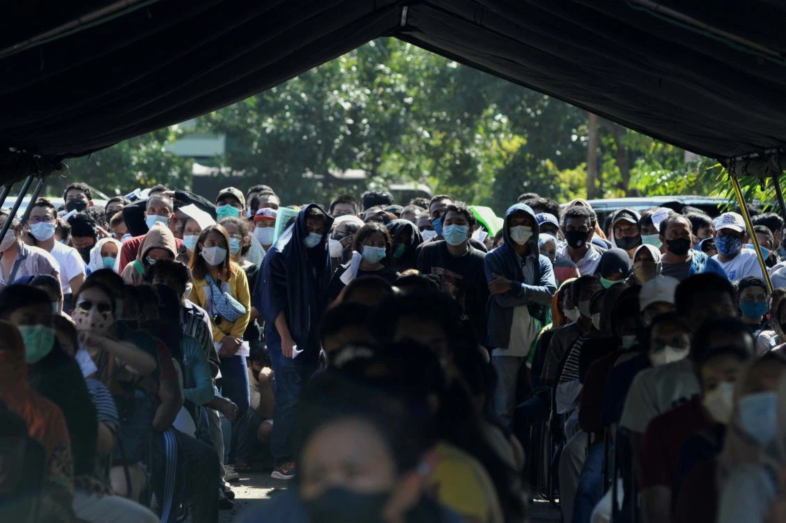 People queue to receive COVID-19 vaccine during a mass vaccination program rollout in Indonesia. Over 4 million people have died of Covid-19 infections, WHO said on Wednesday as countries in Asia battle surging infections. (Reuters)