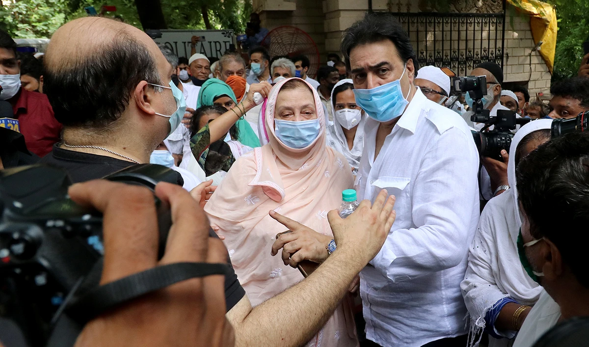 Saira Banu, wife of Bollywood actor Dilip Kumar, leaves her house to attend the funeral of her husband in Mumbai, India, July 7, 2021. (Reuters)