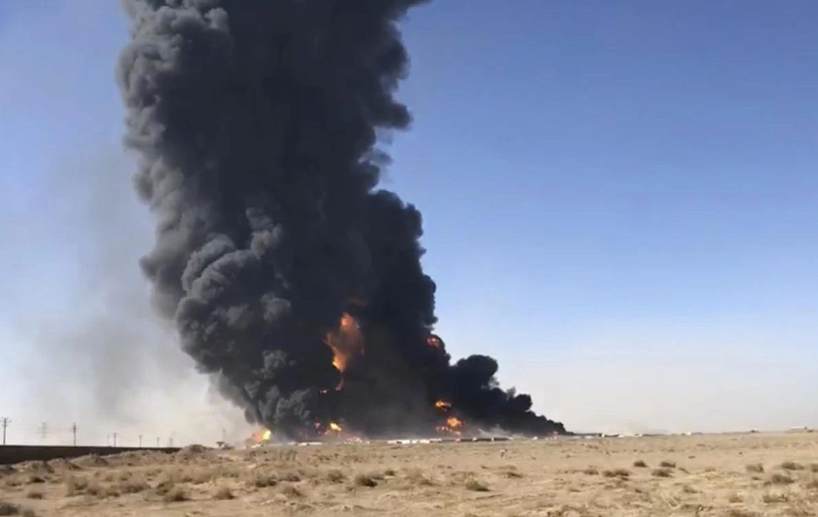 In this Saturday, Feb. 13, 2021 still image taken from video, smoke rises from fuel tankers at the Islam Qala border with Iran, in Herat Province, west of Kabul, Afghanistan. (AP)