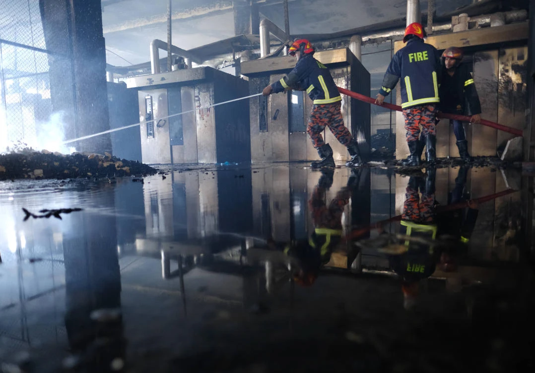 52 dead in Bangladesh factory fire as workers locked inside