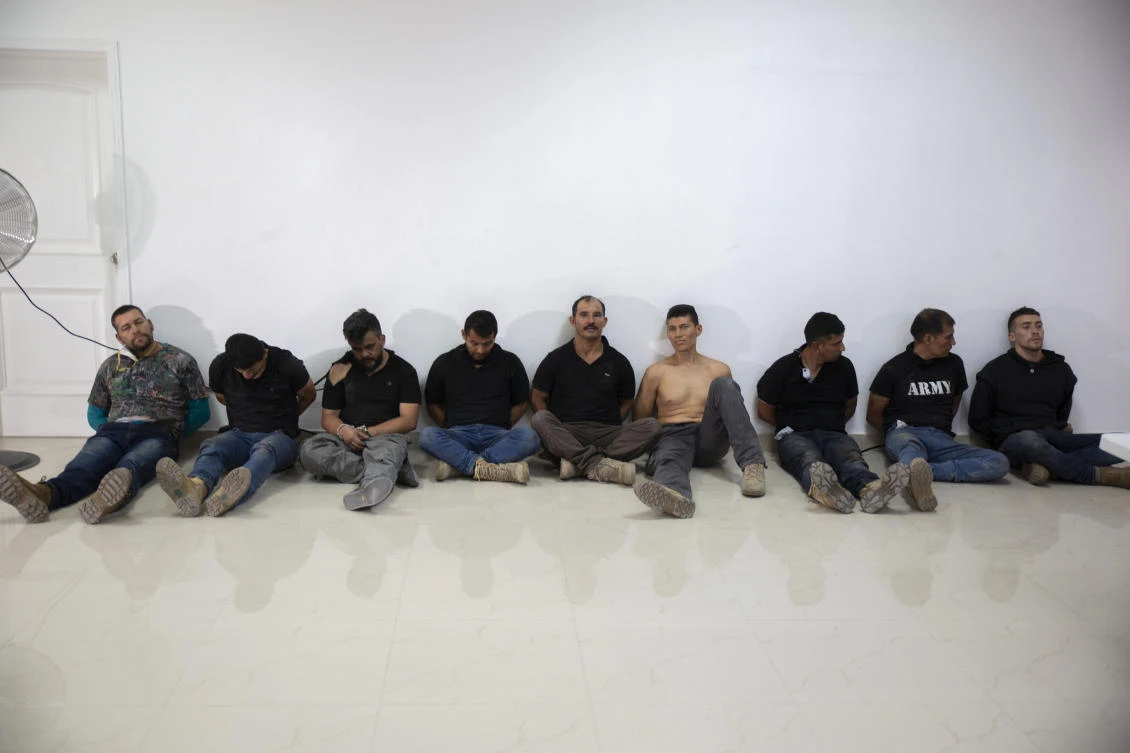 Suspects in the assassination of Haiti's President Jovenel Moise are shown to the media. (AP)