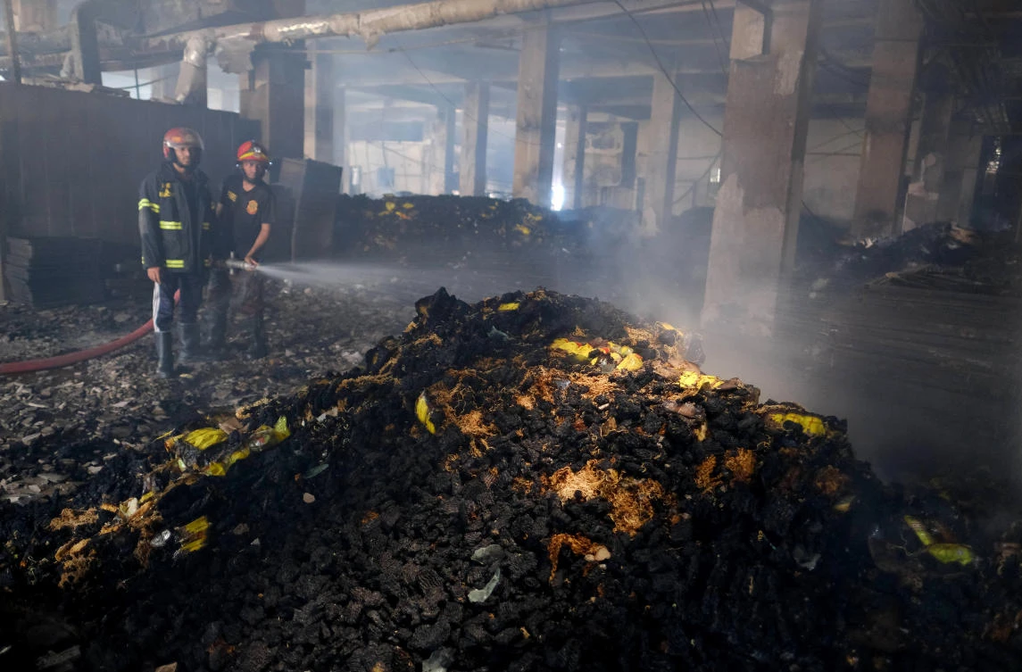 Firefighters work to douse a fire inside a food and beverage factory in Rupganj, outside Dhaka, Bangladesh, Friday, July 9, 2021. (File/AP)
