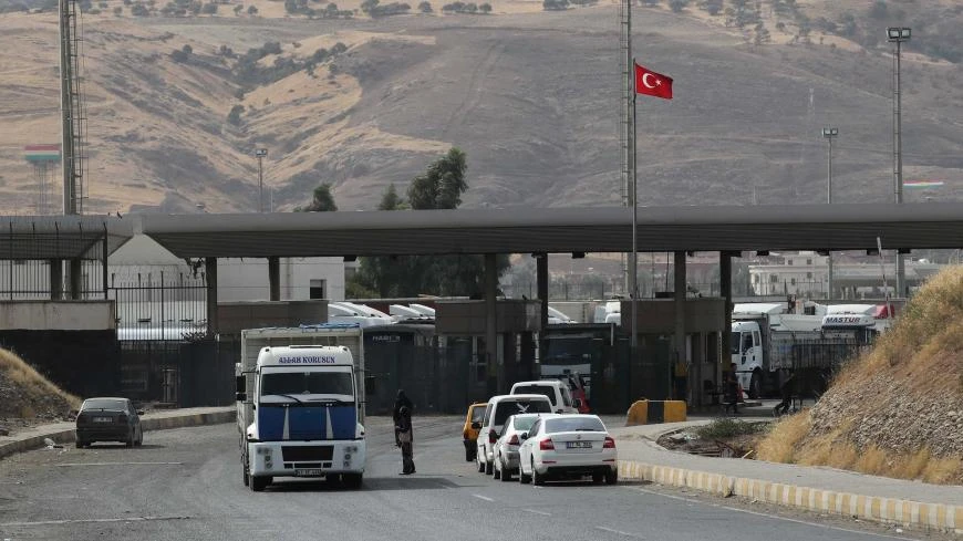 File photo shows trucks lining up after crossing the border between Iraq and Turkey, Sept. 25, 2017. (Reuters)