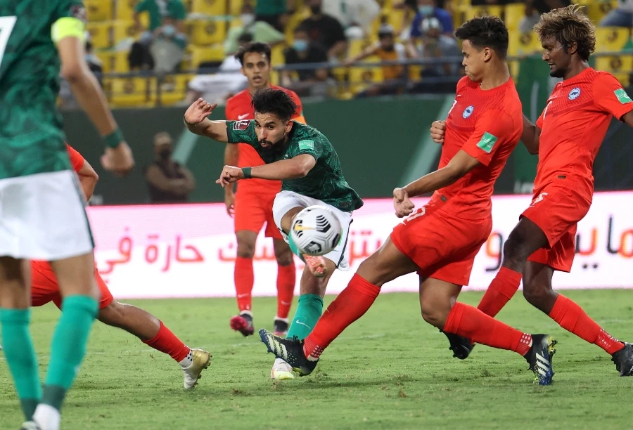 Saudi Arabia's Saleh al-Shehri kicks towards the goal during the 2022 FIFA World Cup qualification group D football match between Saudi Arabia and Singapore at the King Saud University Stadium in Riyadh on June 11, 2021. (File/AFP)