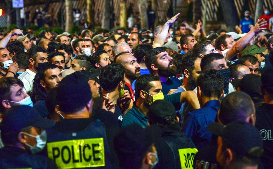 Police officers block counter protesters during a rally in support of those who were injured during the July 5 protests, when a pride march was disrupted by members of violent groups, in Tbilisi on July 6, 2021. (File/AFP)