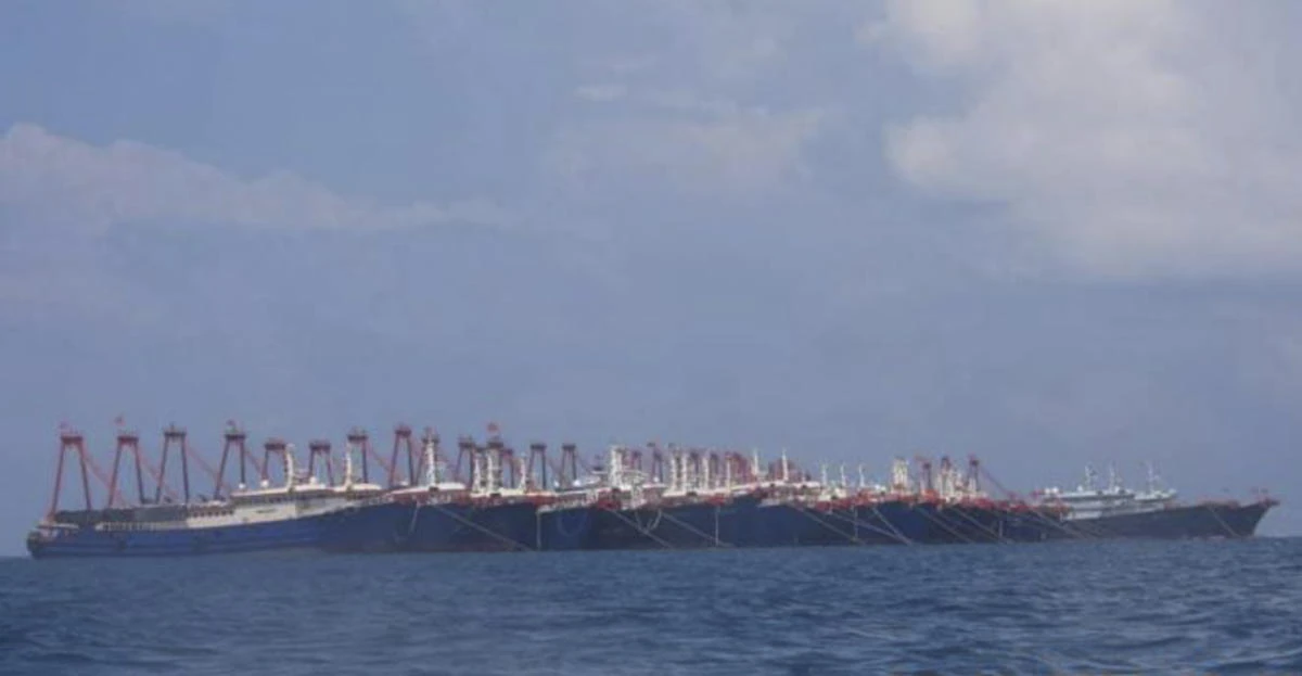 In this March 7, 2021 handout photo, some of the 220 Chinese vessels are seen moored at Whitsun Reef, South China Sea. (AP)