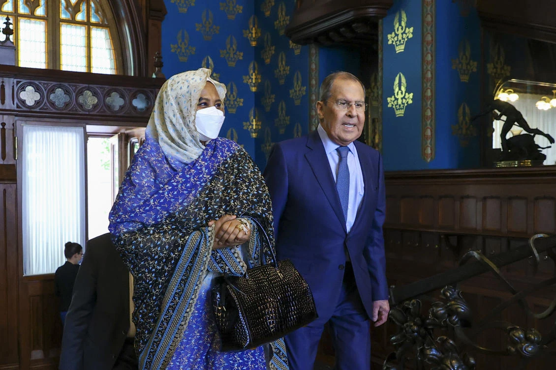 In this photo Russian Foreign Minister Sergey Lavrov, and Sudanese Foreign Minister Maryam al-Sadiq al-Mahdi arrive to attend talks in Moscow, Russia, Monday, July 12, 2021. (Russian Foreign Ministry Press Service via AP)