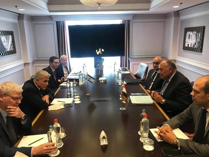 Egyptian Foreign Minister Sameh Shoukry meets his Israeli counterpart Yair Lapid in Brussels. (Twitter/@MfaEgypt)