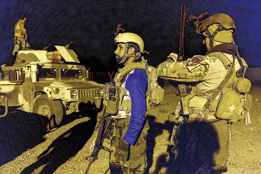 Members of the Afghan Special Forces get ready before a combat mission against Taliban, in Kandahar province, Afghanistan, on Sunday. (Reuters)