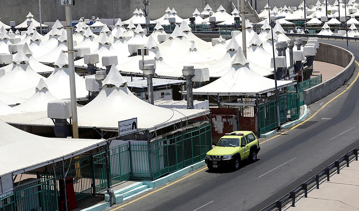 A police vehicle patrols a tent camp in Mina, near the holy city of Makkah, ahead of the upcoming annual Hajj pilgrimage. (AP)