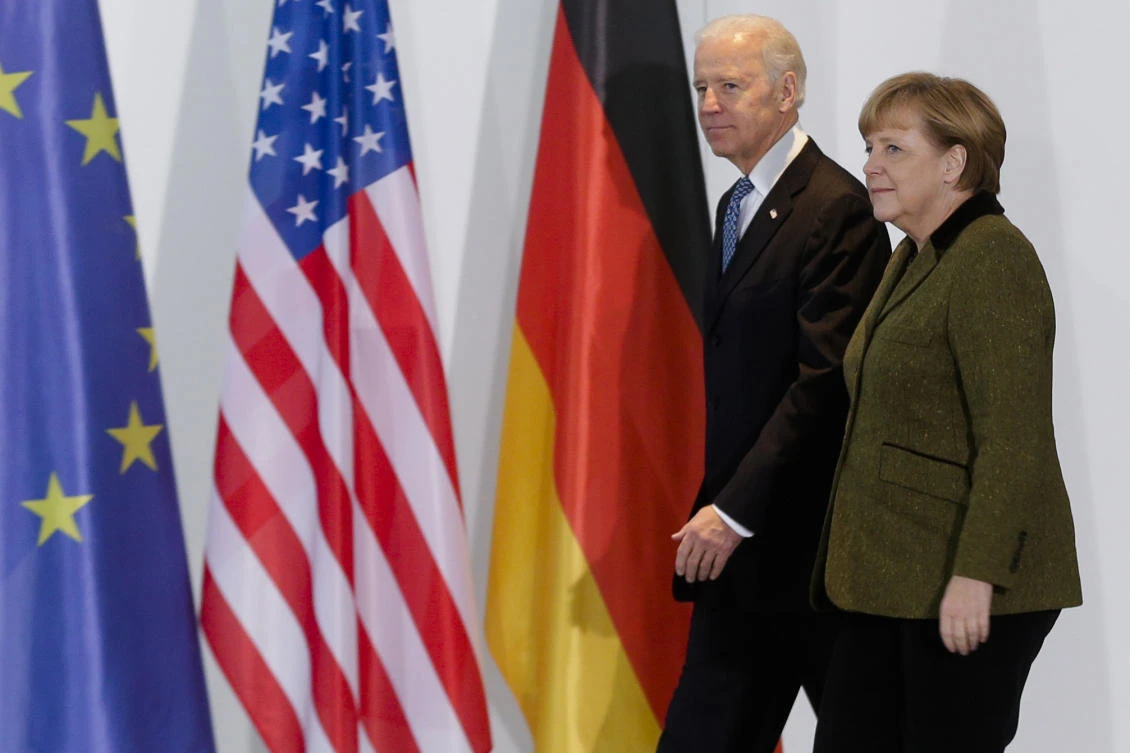 In this Feb. 1, 2013 file photo, German Chancellor Angela Merkel, right, and United States' President Joe Biden. (AP)