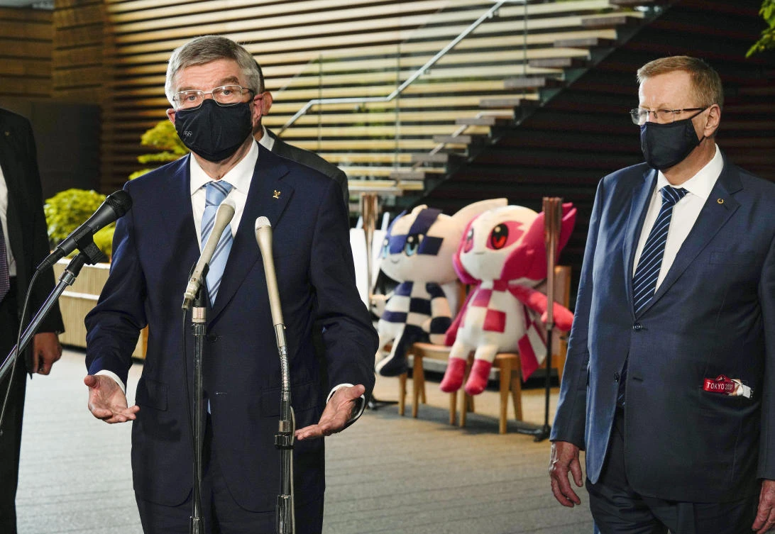 International Olympic Committee President Thomas Bach speaks after meeting Japanese Prime Minister Yoshihide Suga in Tokyo on Wednesday. Bach said Thursday there was “zero” risk of Games participants infecting Japanese residents with COVID-19. (AP)