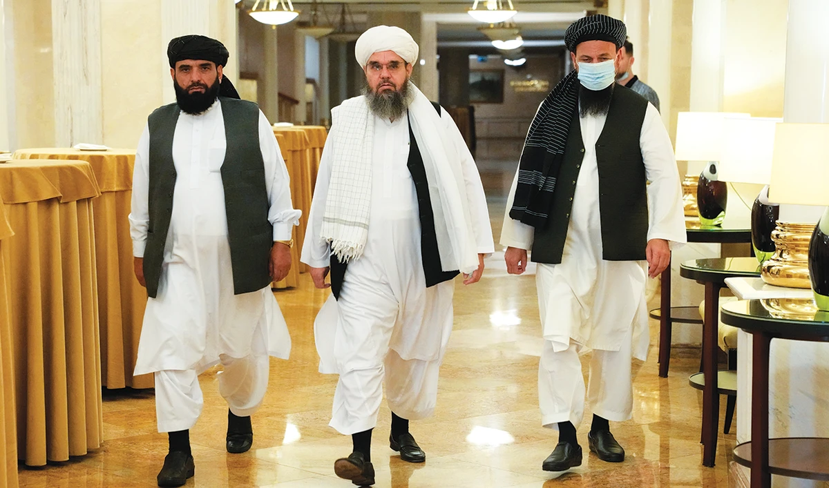 Taliban spokesman Suhail Shaheen, left, with other members of political delegation from the Afghan Taliban’s movement at a news conference in Moscow. (File/AP)