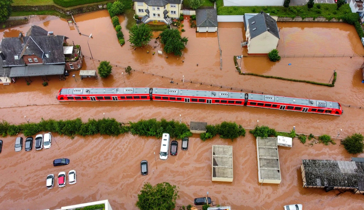 A regional train sits in the flood waters at the local station in Kordel, Germany, on July 15, 2021. (Sebastian Schmitt/DPA via AP)