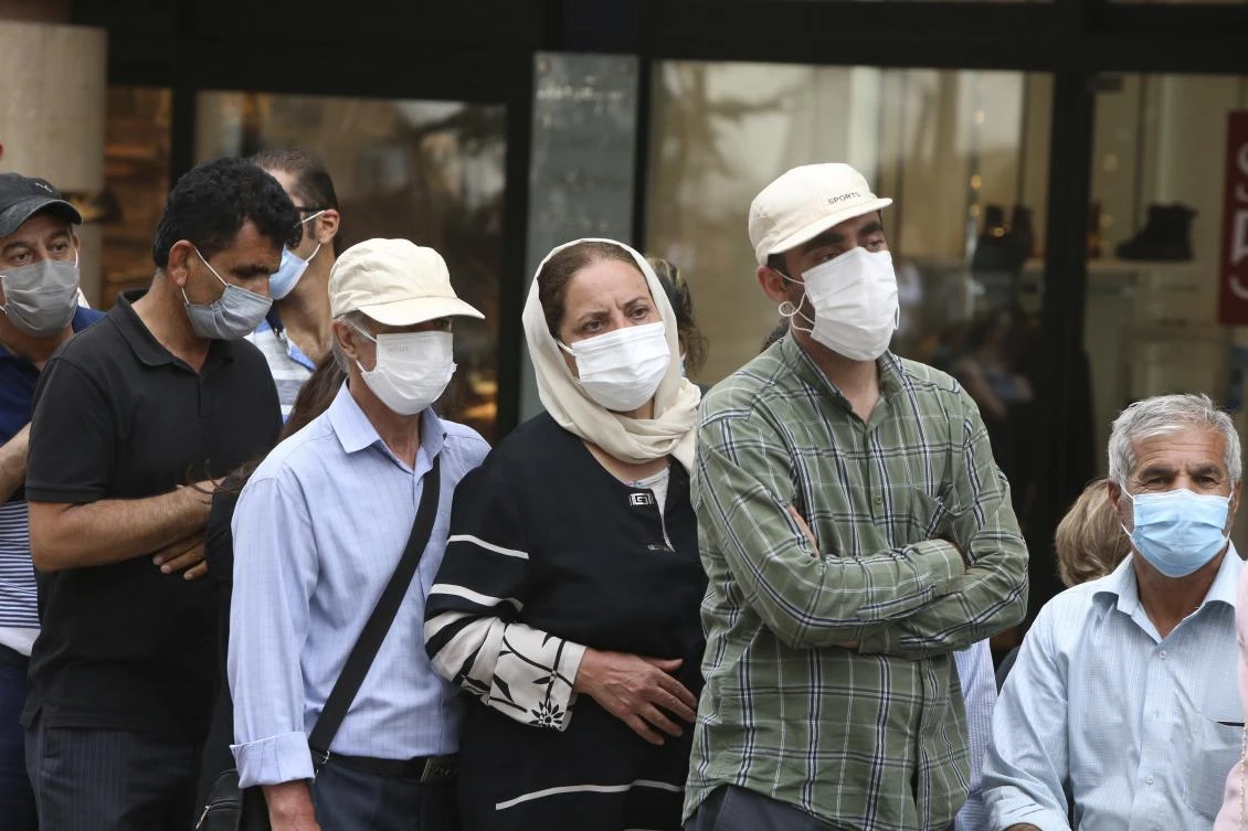 People stand in line for a coronavirus vaccine shot at a mobile vaccination station in the center of in Yerevan, Armenia, Wednesday, July 14, 2021. (Vahram Baghdasaryan/AP)