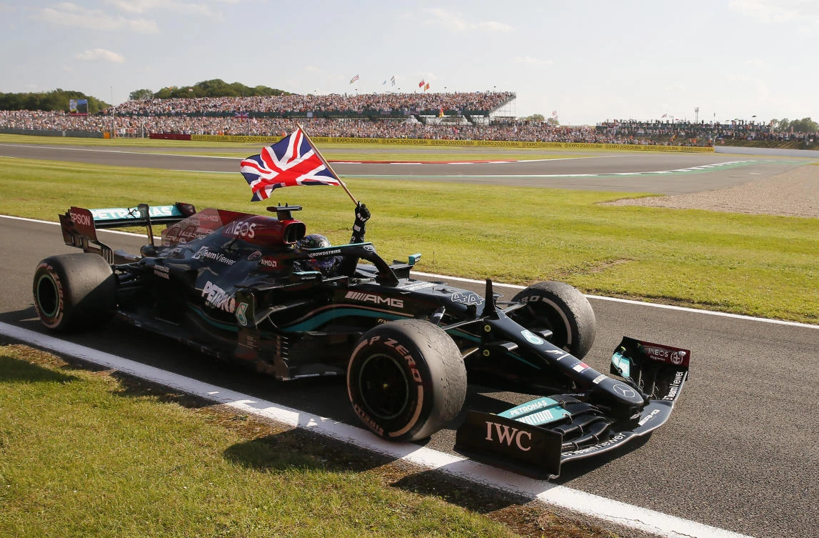 Mercedes' Lewis Hamilton celebrates after winning the race. (Reuters)