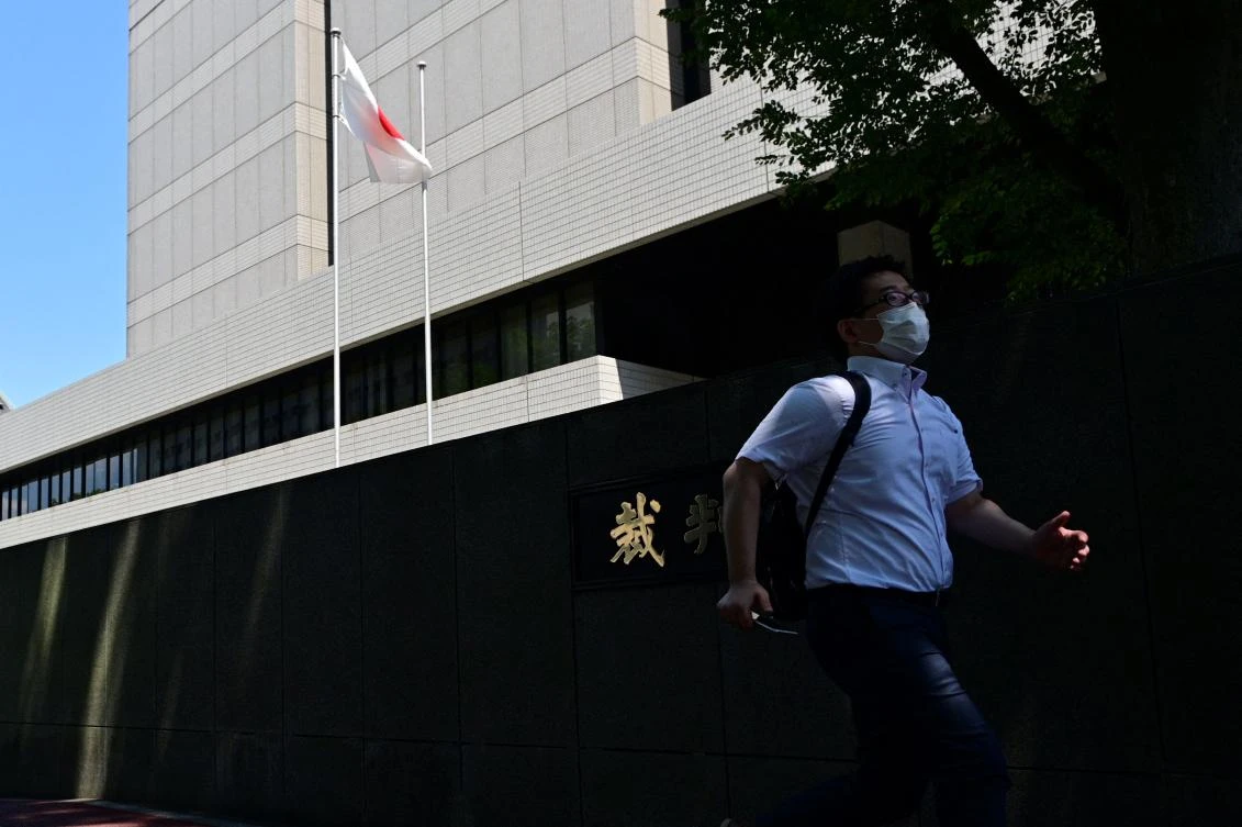 Former US special forces member Michael Taylor and his son Peter, who allegedly helped fly former Nissan chief Carlos Ghosn out of Japan in 2019, arrived at the court ahead of their verdict in Tokyo on July 19, 2021. (AFP)
