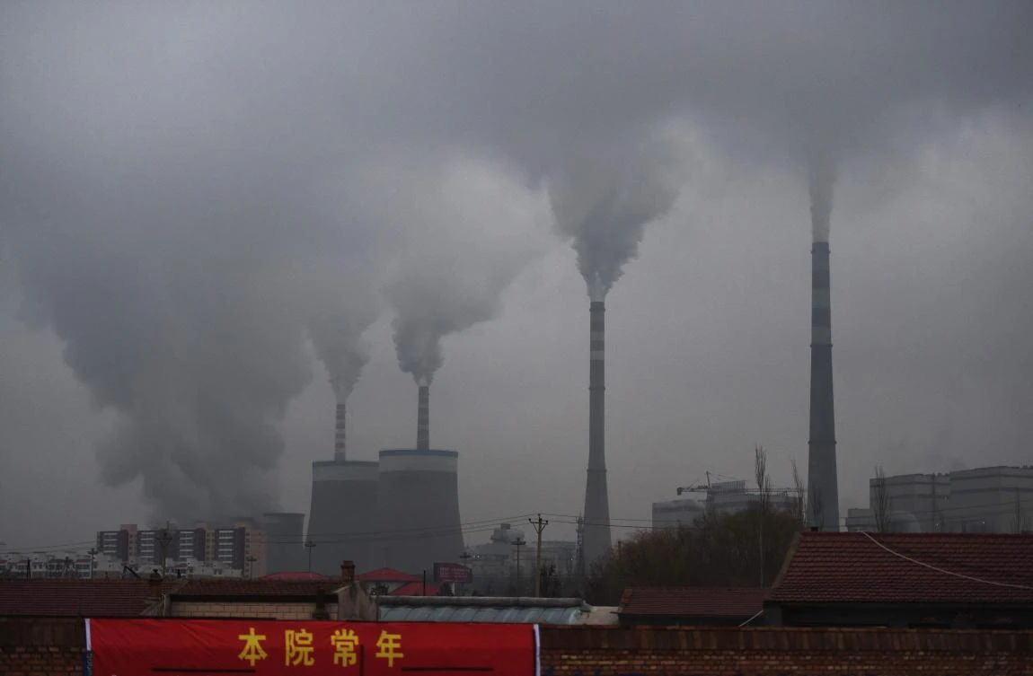Smoke belches from a coal-fueled power station in China’s northern Shanxi province. (AFP)