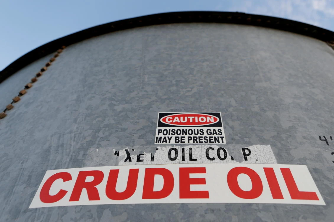 FILE PHOTO: A sticker reads crude oil on the side of a storage tank in the Permian Basin. (Reuters)