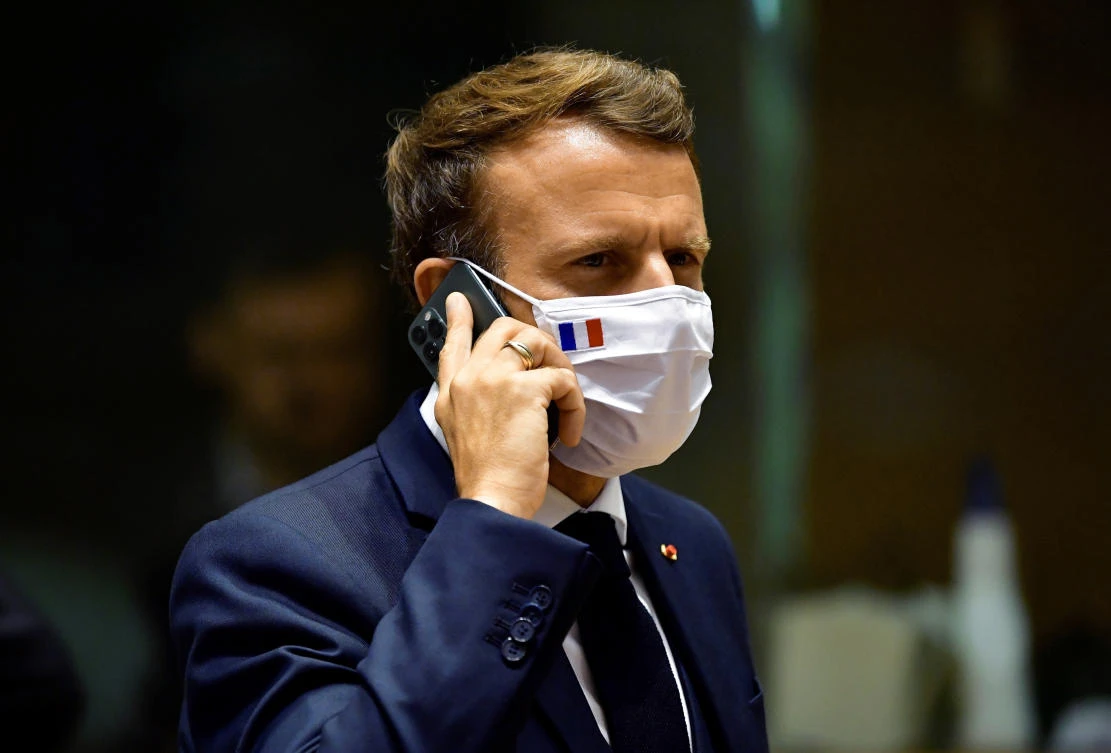 In this Monday, July 20, 2020 file photo, French President Emmanuel Macron speaks on his mobile phone during a round table meeting at an EU summit in Brussels. (File/AP)
