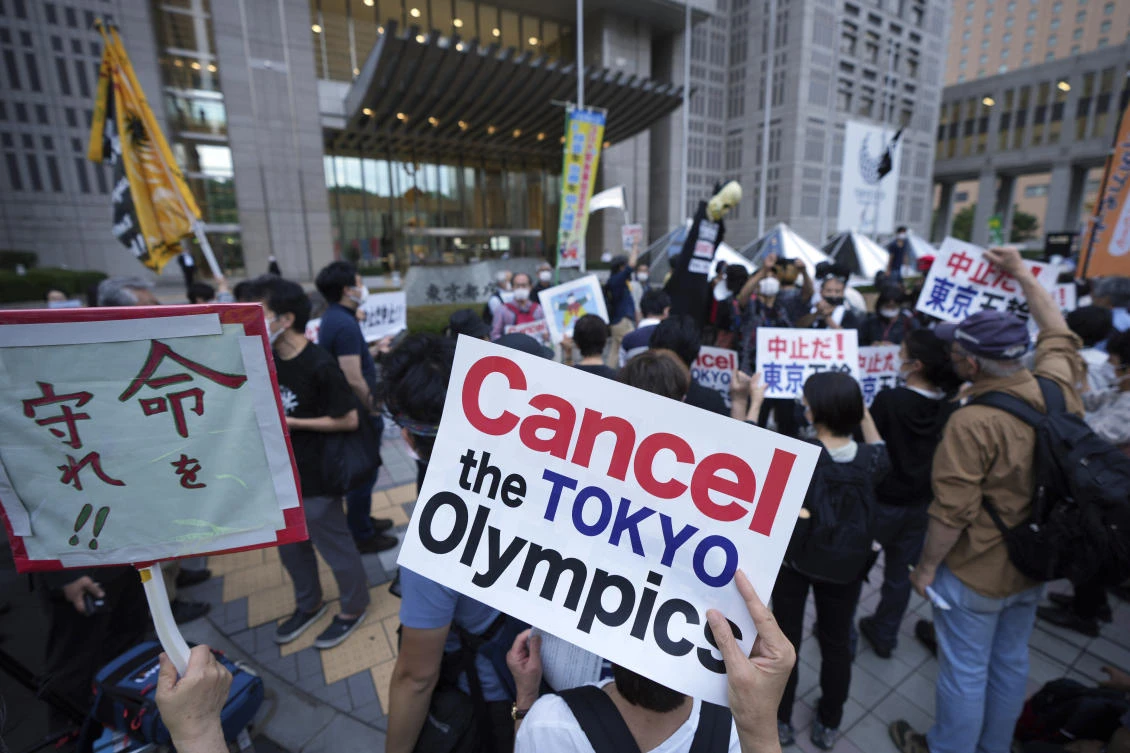 In this June 23, 2021, file photo, people against the July opening of the Tokyo 2020 Olympics, gather to protest around the Tokyo Metropolitan Government building during a demonstration in Tokyo. (AP)
