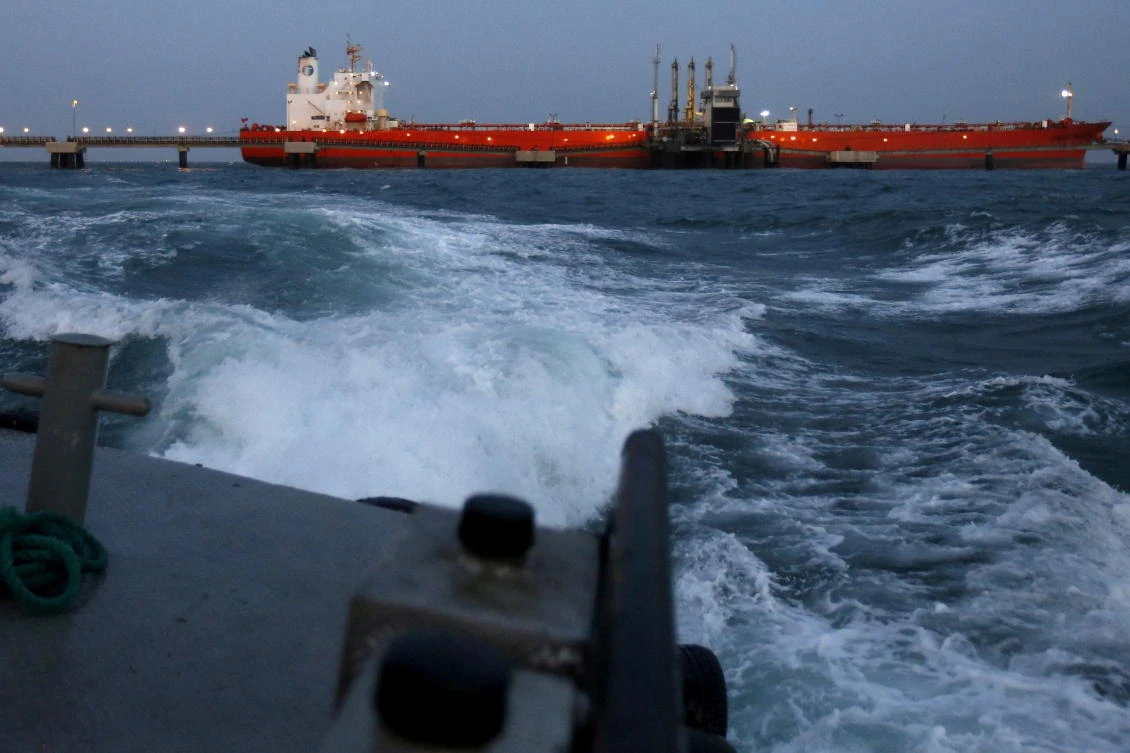 An oil tanker is docked while oil is pumped into it at a PDVSA terminal in Venezuela. (Reuters)