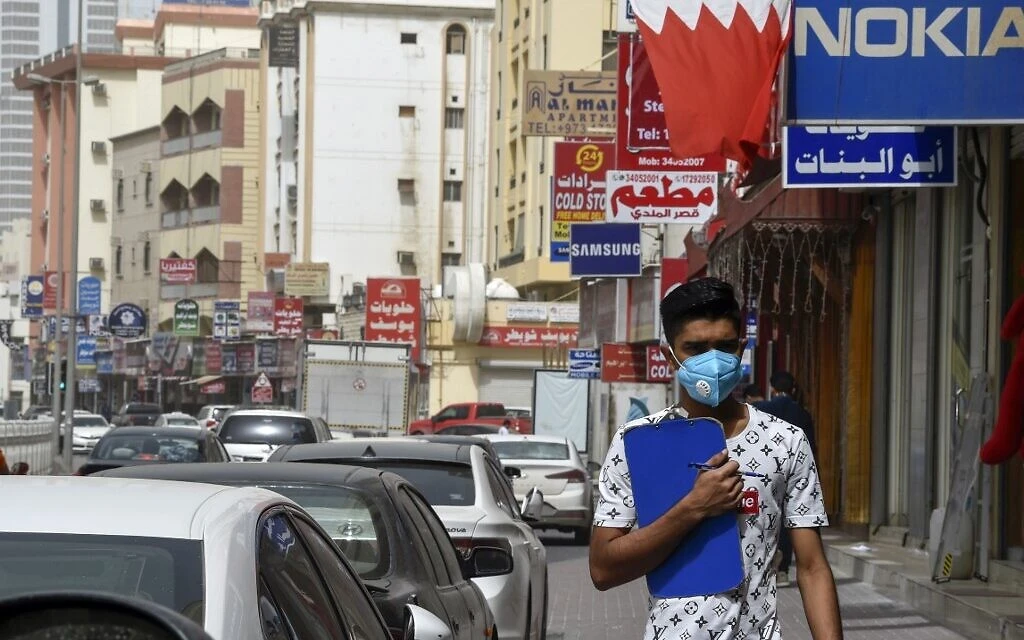 A man wearing a surgical mask is pictured in the heart of the Bahraini capital Manama. (File/AFP)