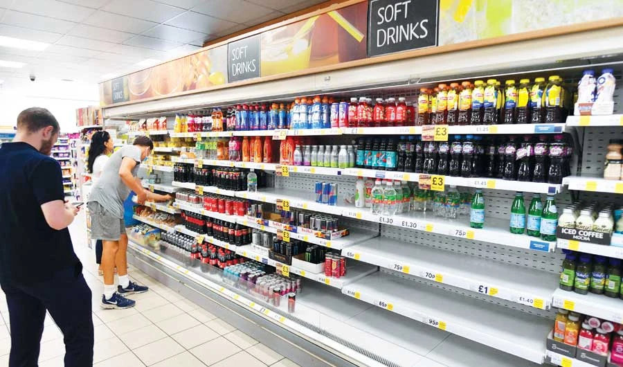 British supermarkets and suppliers warned on Thursday of possible food shortages due to staff self-isolating, as rising coronavirus cases threaten chaos. (AFP)