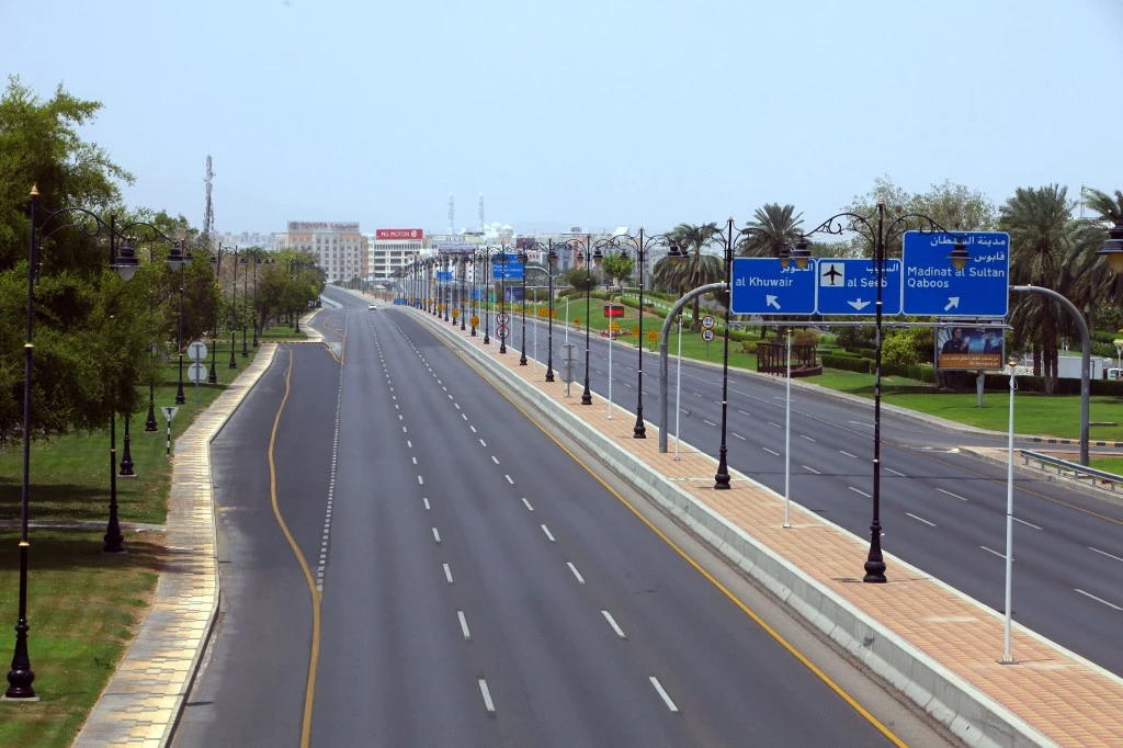 Above, an empty Sultan Qaboos Street in the Omani capital Muscat amidst a COVID-19 lockdown during the Eid holidays. (AFP)