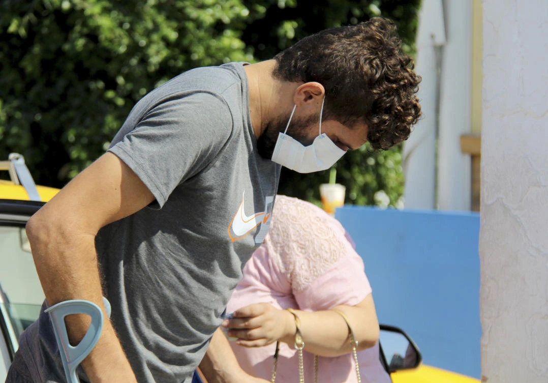 A man wearing a face mask to protect from COVID-19 arrives at a hospital in Tunis, Wednesday, July 21, 2021. (AP)