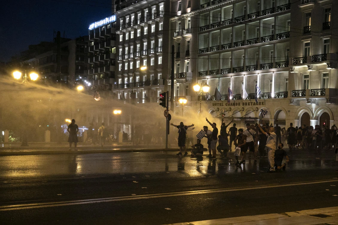 Greek police clash with protesters in rally against mandatory vaccinations