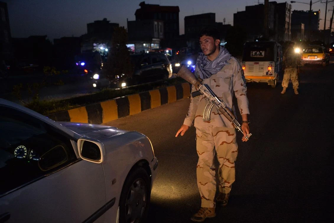 A security personnel stops a vehicle at a check point in Herat on July 24, 2021, as a night curfew was imposed to curb surging violence unleashed by a sweeping Taliban offensive in recent months, the interior ministry said. (AFP)