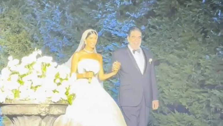 Former Hezbollah MP Nawwar Al-Sahili walked his elegantly-dressed daughter through fireworks-laden walkways and striking strobe lights this week. (Screenshot)