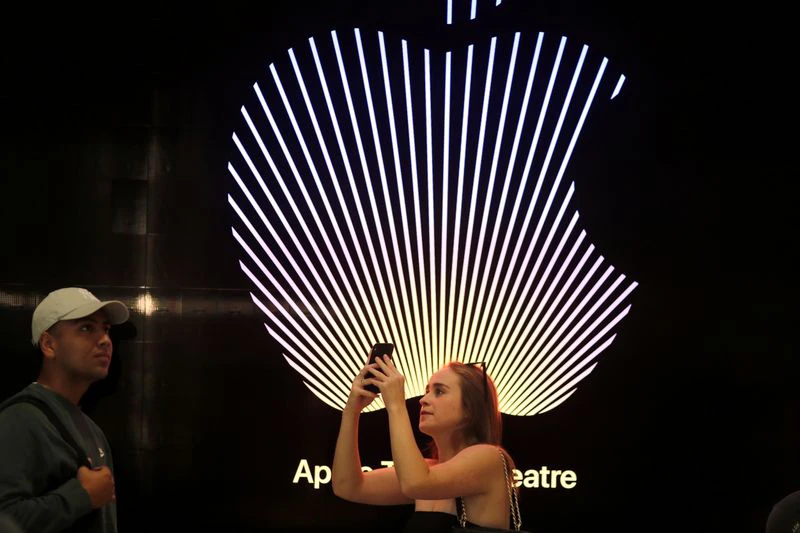 Customers walk around the new Apple Store on Broadway in downtown Los Angeles, California, US, June 24, 2021. (Reuters)