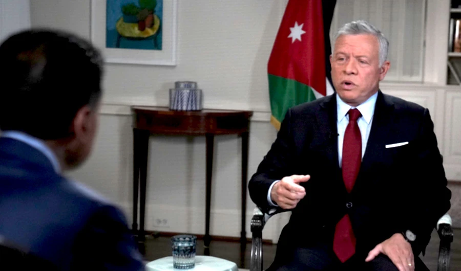 Jordan’s King Abdullah II gestures during an interview with Petra News Agency on January 30, 2021. (Screenshot/Petra News Agency)