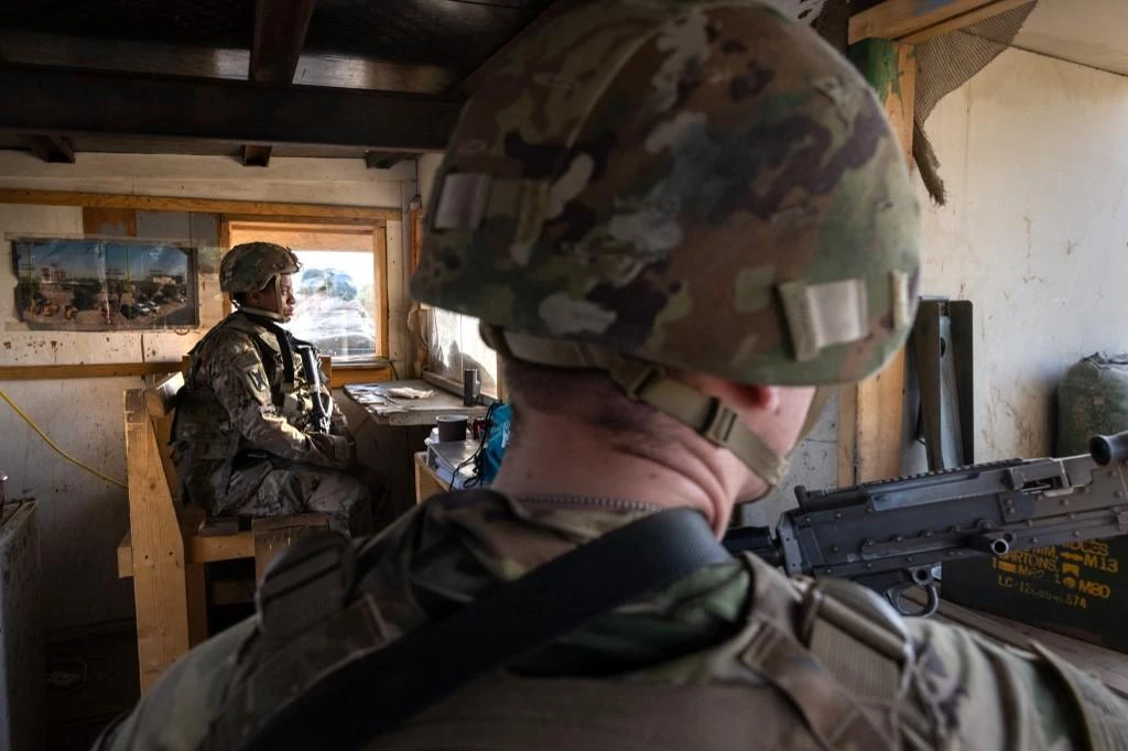 Above, US army soldiers at the perimeter of the International Zone on May 30, 2021 in Baghdad. US troops are to transition to a train-and-advise roles in Iraq. (Getty Images via AFP)