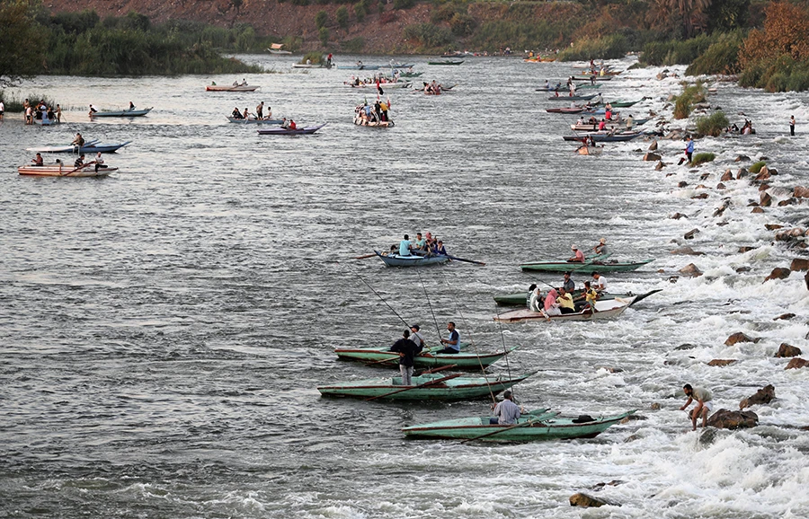 Fishermen are seen on boats on the Nile River on the outskirts of Cairo, Egypt July 23, 2021. (Reuters)