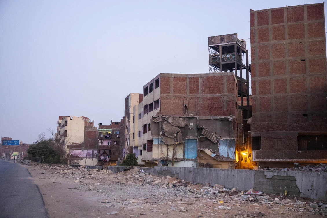 Apartments have been partially demolished as part of a megaprojects campaign to relieve congestion in Cairo. An apartment building in Cairo collapsed Tuesday, killing a man while rescue workers hours later pulled his wife alive. (AP)