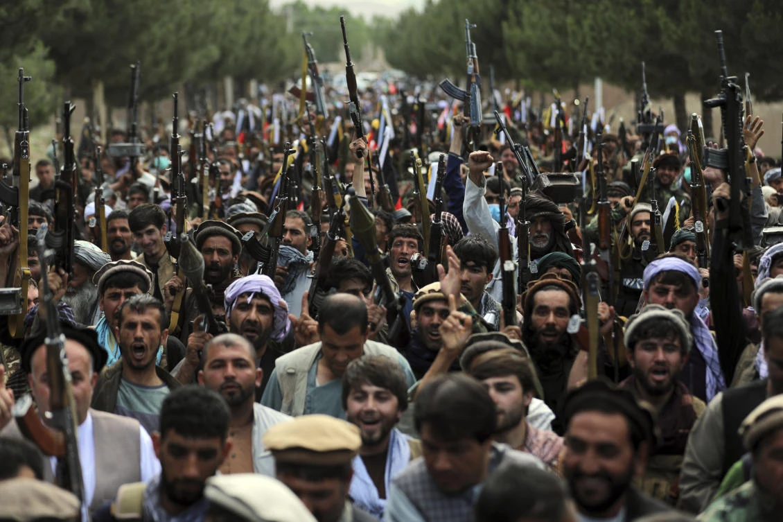In this June 23, 2021 file photo, Afghan militiamen join Afghan defense and security forces during a gathering in Kabul, Afghanistan. (AP Photo)