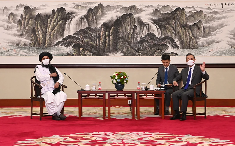 Taliban negotiator and deputy leader Mullah Baradar Akhund (left) poses for a picture with Chinese Foreign Minister Wang Yi (right) in China on July 28, 2021. (Photo courtesy: @MFA_China/Twitter)