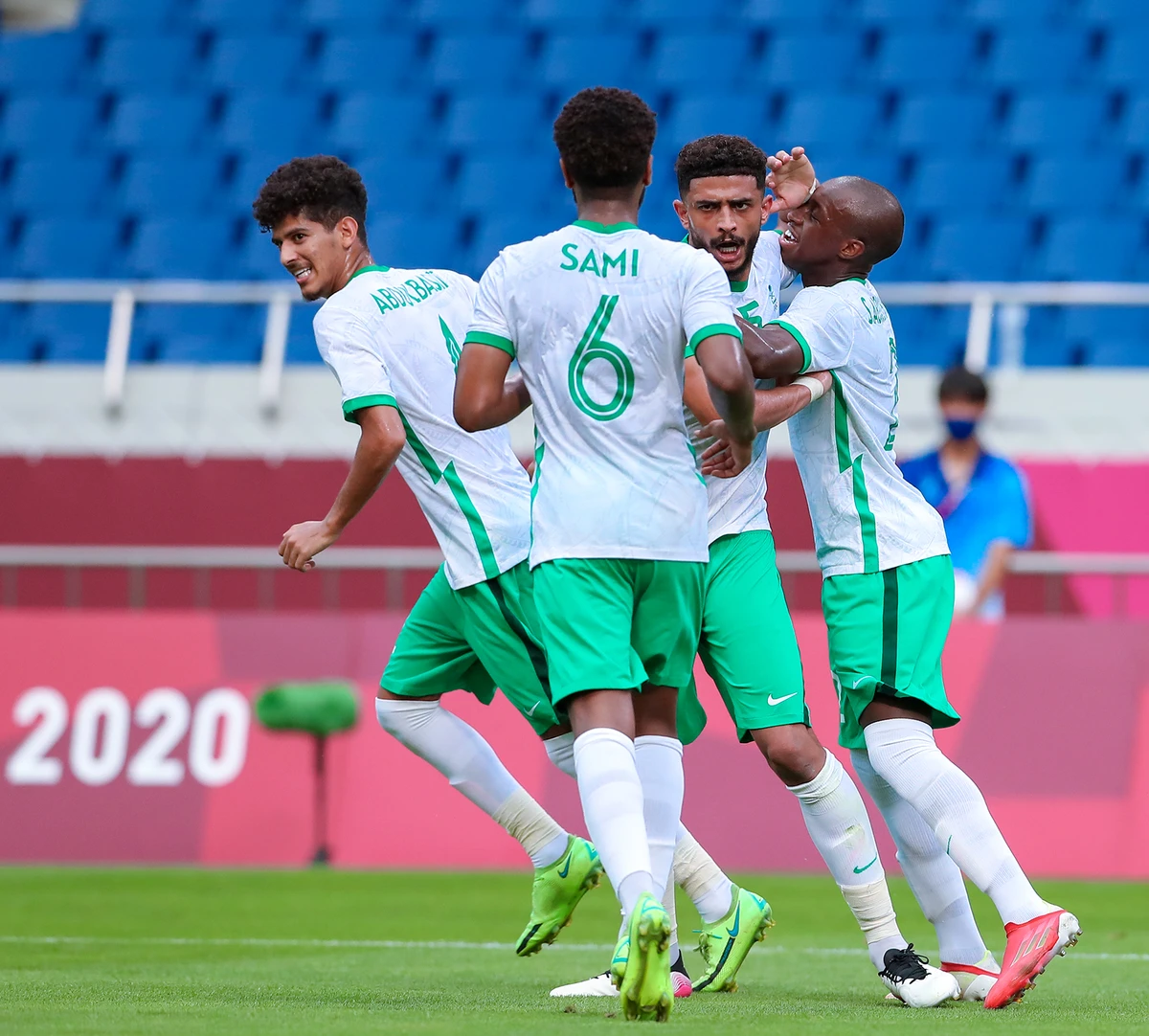 Saudi players celebrate Abdulelah Al-Amri’s equalizer against Brazil. (SAOC)