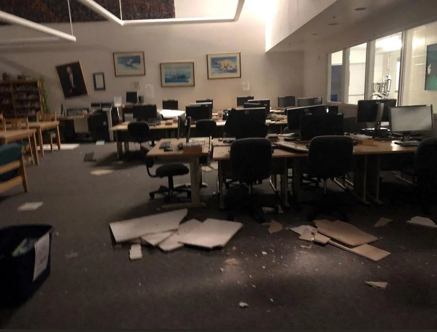 In this image courtesy of Dr. Holy A. Bell, books and ceiling tiles litter the floor at the The Mat-Su College library in Anchorage, Alaska, on November 30, 2018, after a 7.0 magnitude earthquake. (File/AFP)