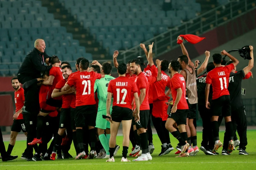 Egypt's players celebrate their victory against Australia after the Tokyo 2020 Olympic Games men's group C first round football match between Australia and Egypt on July 28, 2021. (AFP)