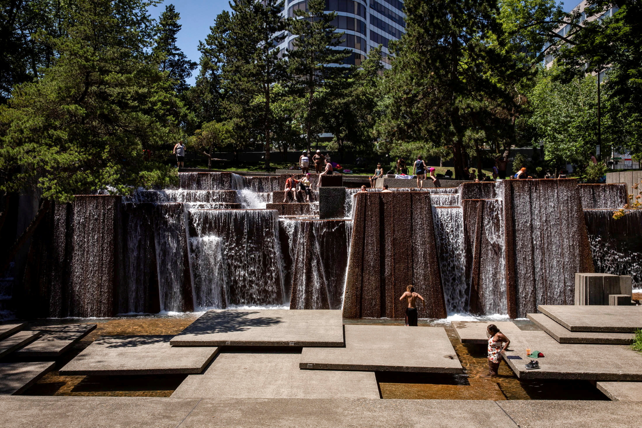 People cool off in a public fountain during an unprecedented heat wave in Portland, Oregon, U.S., June 27, 2021. (Reuters)