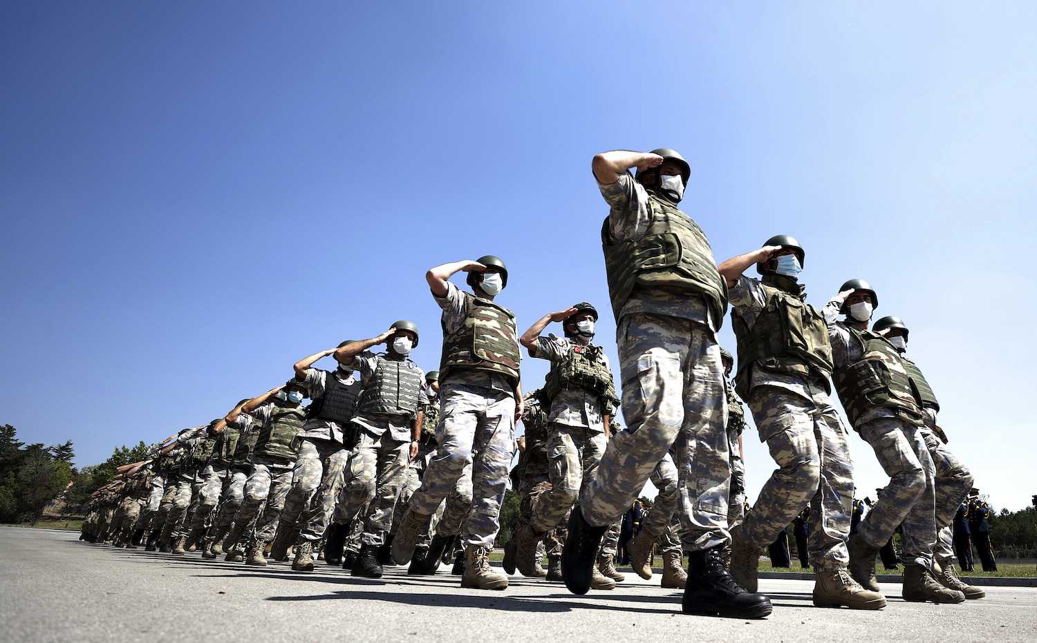 Turkish troops who were operating Hamid Karzai International Airport in Kabul, Afghanistan, march during a ceremony at Ankara airport, Turkey, Saturday, Aug. 28, 2021. (AP)