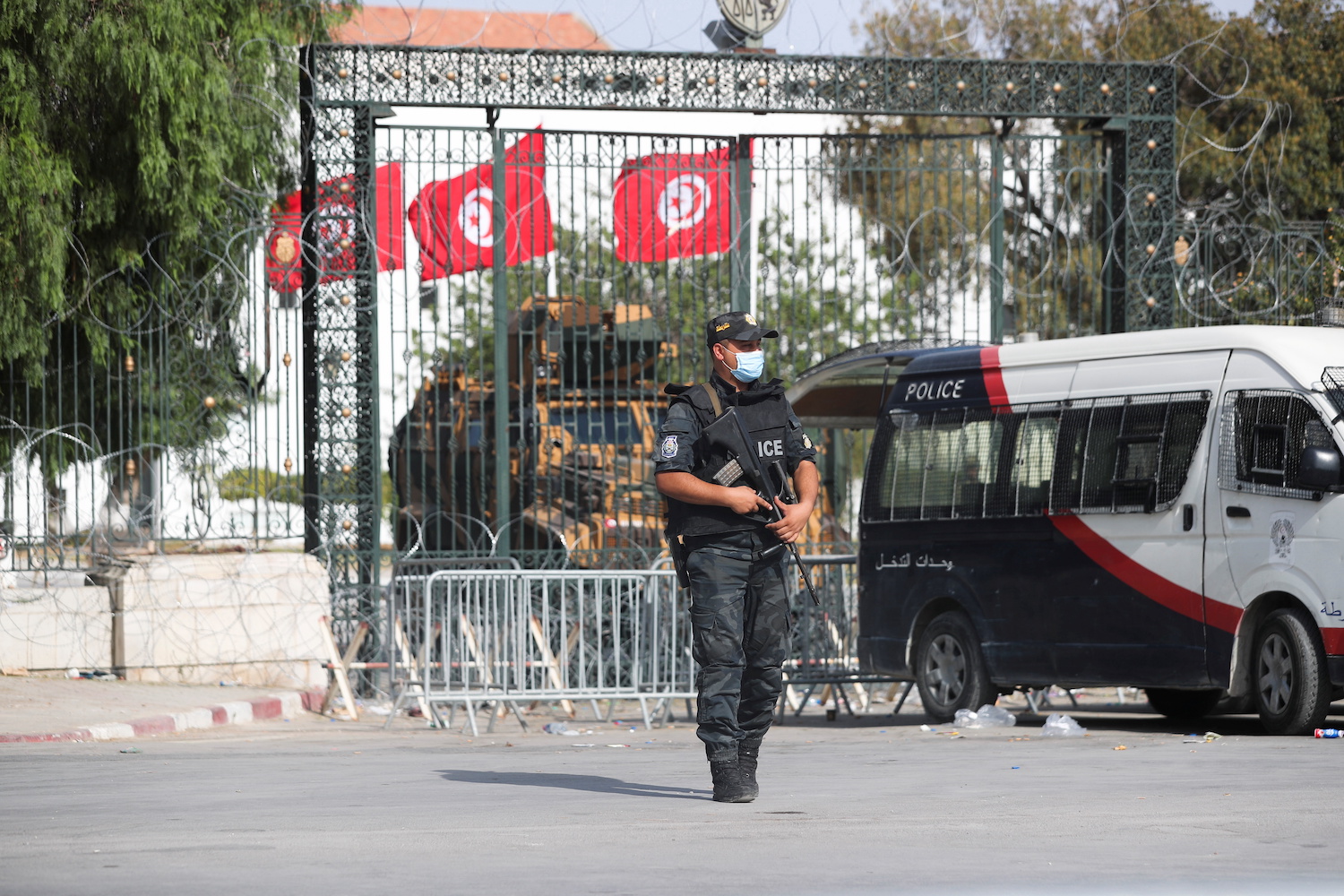 A police officer stands guard outside the parliament building in Tunis,Tunisia on July 29, 2021. (Reuters)
