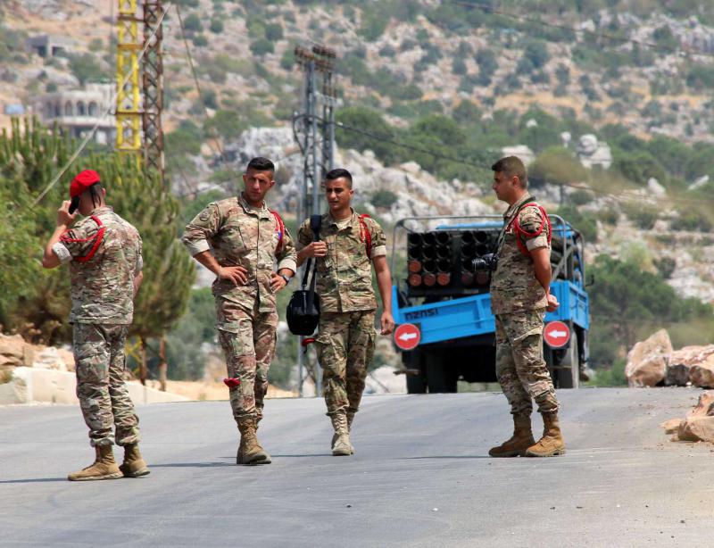 Lebanese army soldiers stand near a pickup truck containing a rocket launcher in Chouaya, Lebanon, August 6, 2021. (Reuters)
