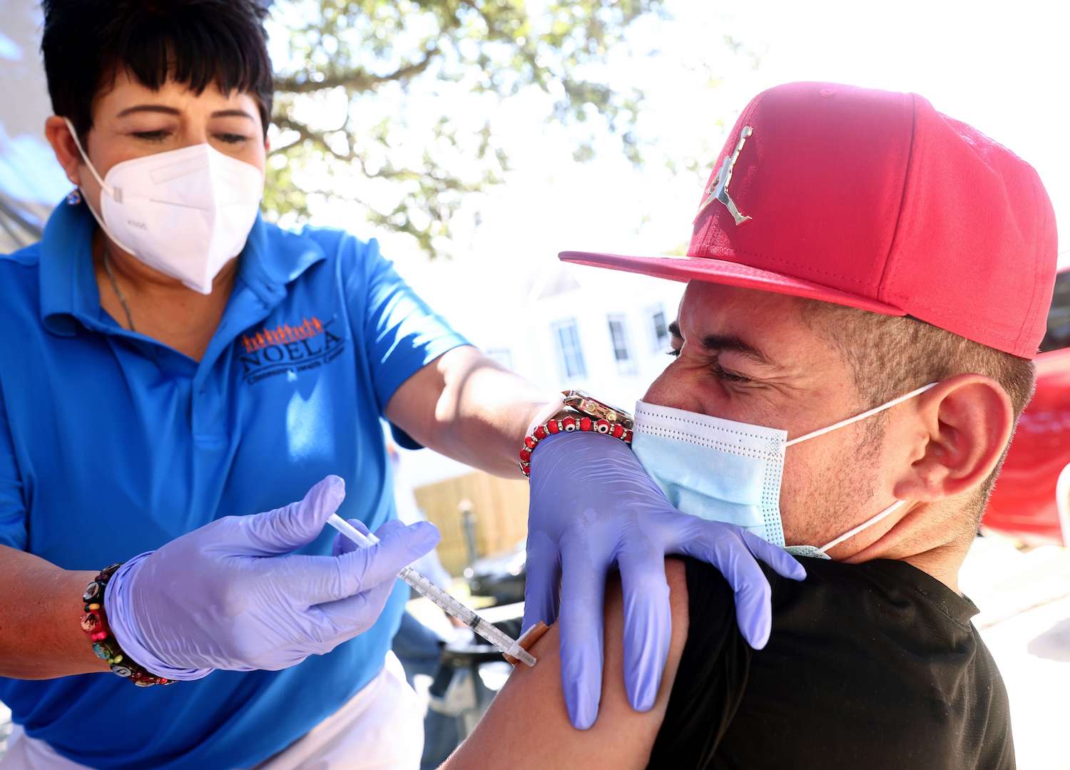 A COVID-19 vaccination dose is administered to a man on August 14, 2021 in New Orleans, Louisiana. (AFP)