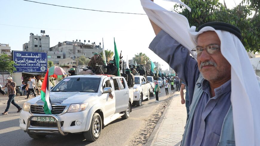Members of the Izz ad-Din al-Qassam Brigades, the armed wing of the Hamas movement, parade in Khan Yunis, in the Gaza Strip, May 27, 2021. (AFP)